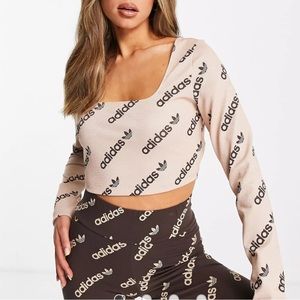 adidas Originals 'Logomania' repeat logo long sleeve cropped top in blush